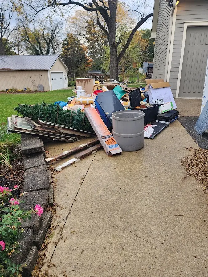 Dumpster being loaded with debris for Residential Dumpster Rental in Norton